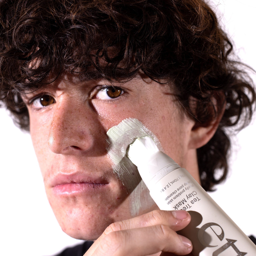 The Brush on Clay Mask being Applied to a young man.